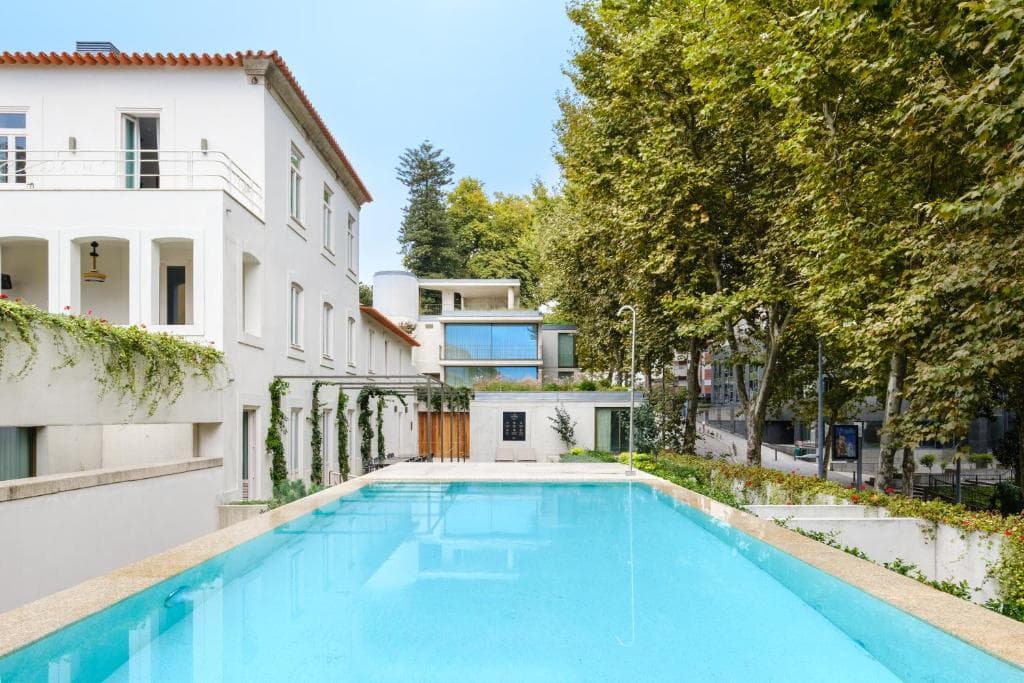 The pool at Reframe Stay, set within a walled garden thumbnail 2