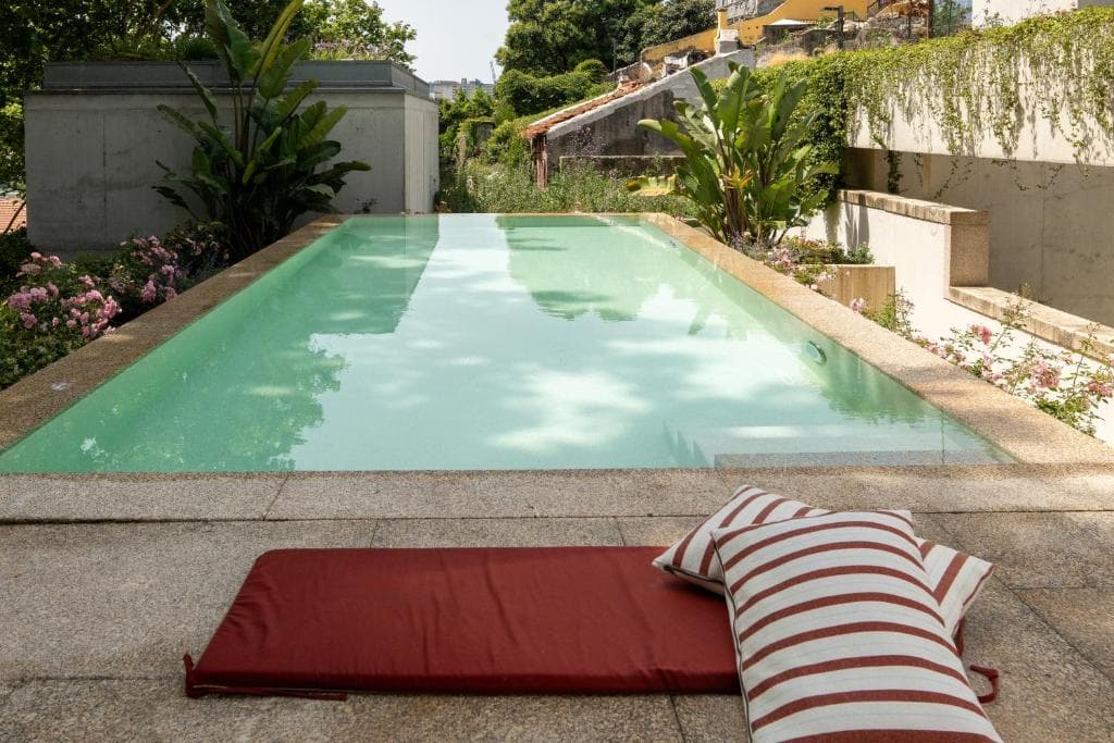 The pool at Reframe Stay, set within a walled garden thumbnail 3